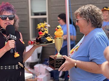 RJ Owens (right) presents Duckerating Trophy to winner Brenda Thomas