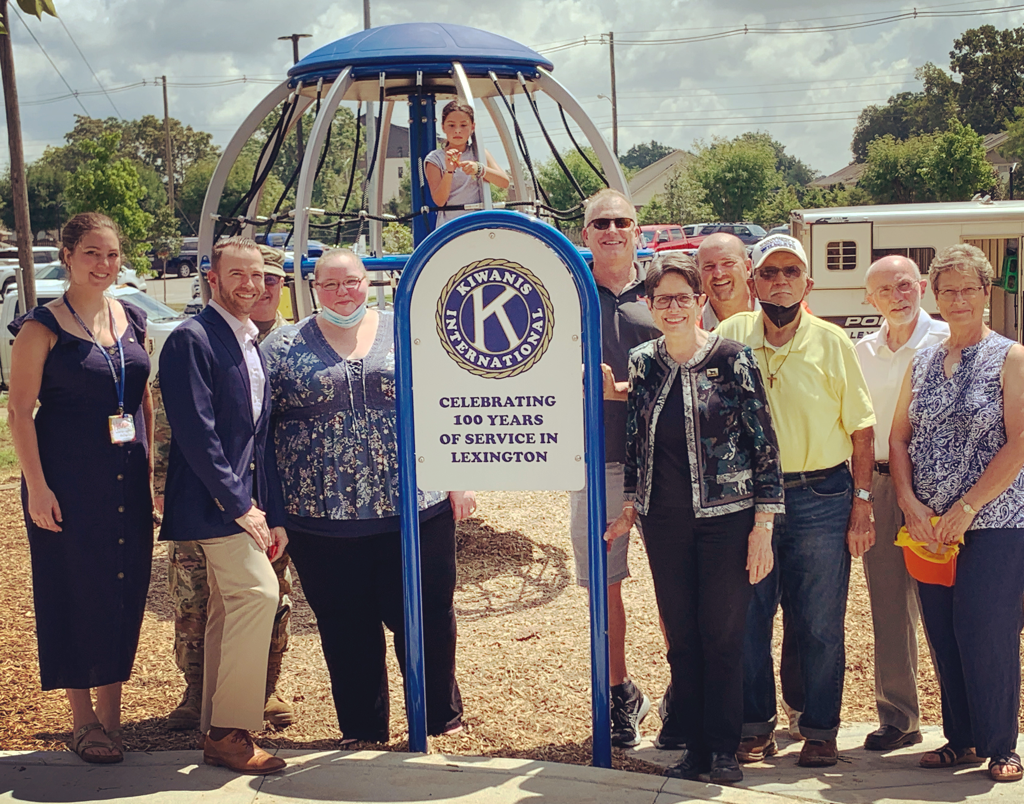 Joining the effort to bring play downtown, on August 20th, 2021, the Kiwanis Club of Lexington donated a Global Motion. Pictured here on park dedication day; a few of our members, officers and the Mayor of Lexington.